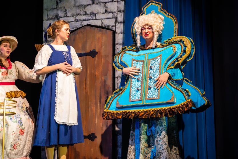 Actors perform onstage